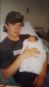 Peter Harris holding baby.