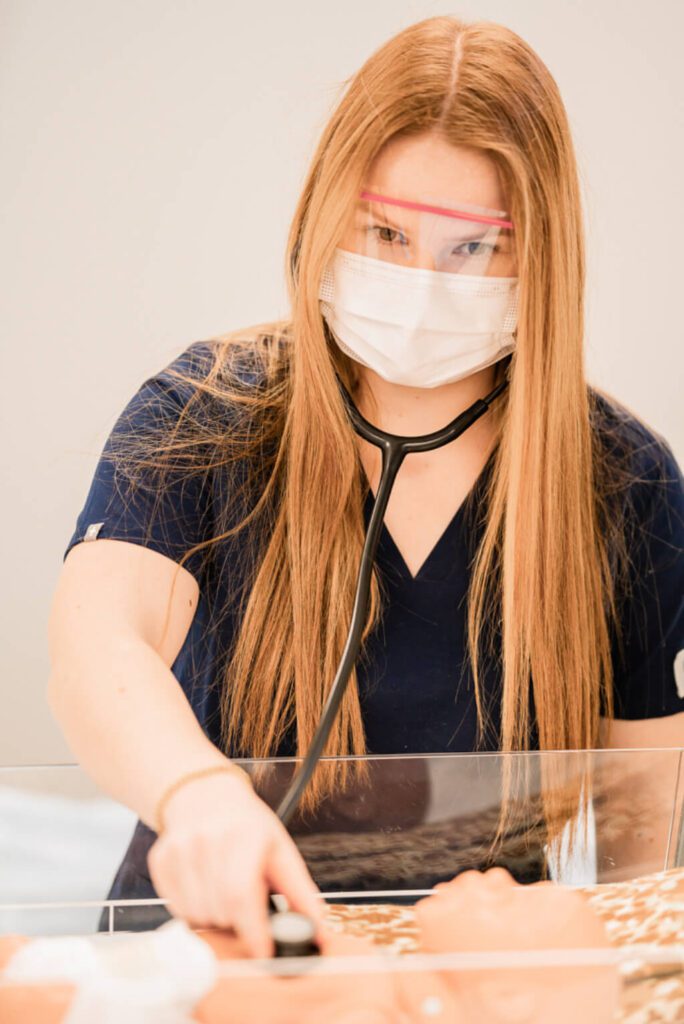 Bachelor of Nursing student working on test.