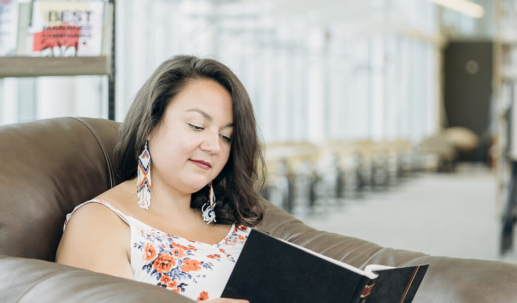 Student reading a textbook.