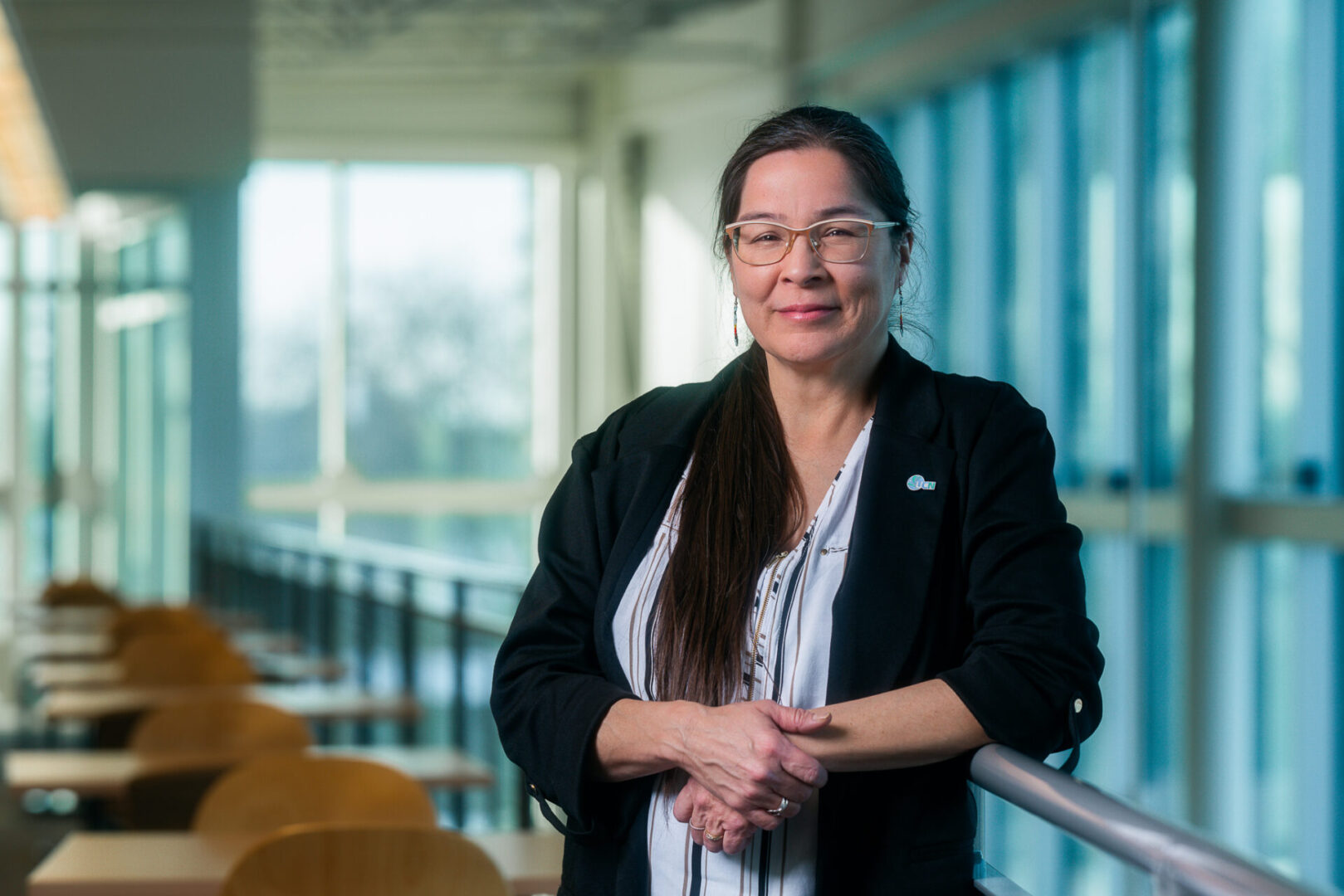 Melissa Constant leaning against railing.