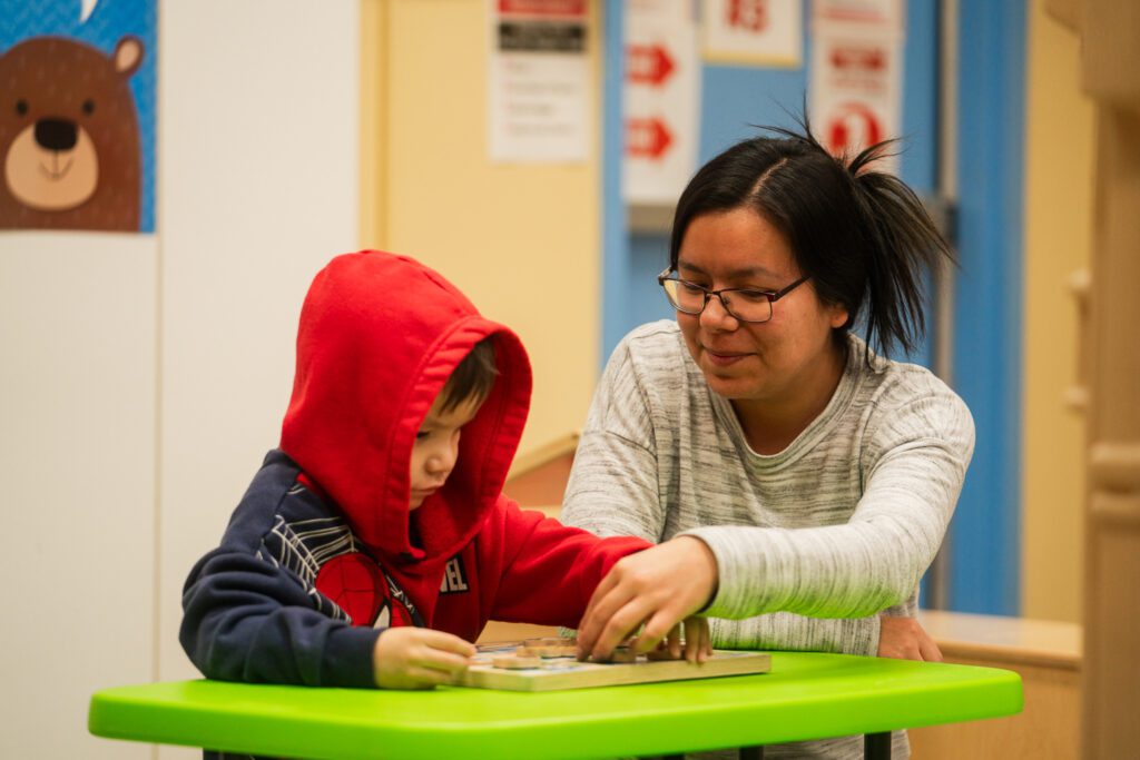 Early Childhood educator teaching student