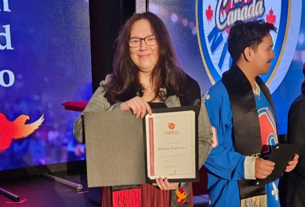 Alum Melanie Halcrowe with Developer Award.