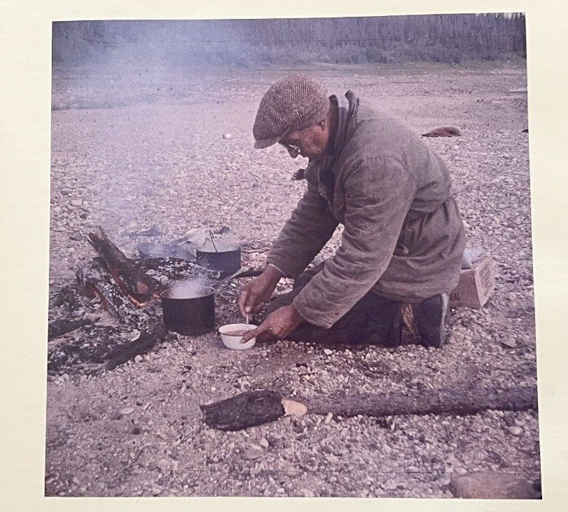 Albert (Bert) Brown Cooking over a fire